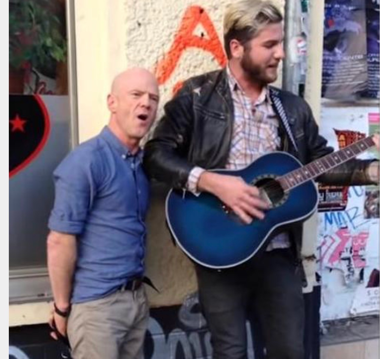 A street musician is playing a song on his guitar… and then the original performer walks up to him. Here’s what happened next.